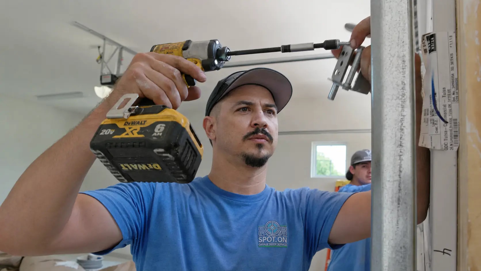 Spot On Garage Door technician performing residential garage door repair in Roseville, California